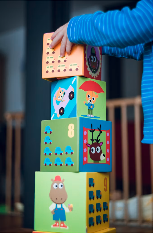 Children engaged in play-based learning at Tots N Us Academy